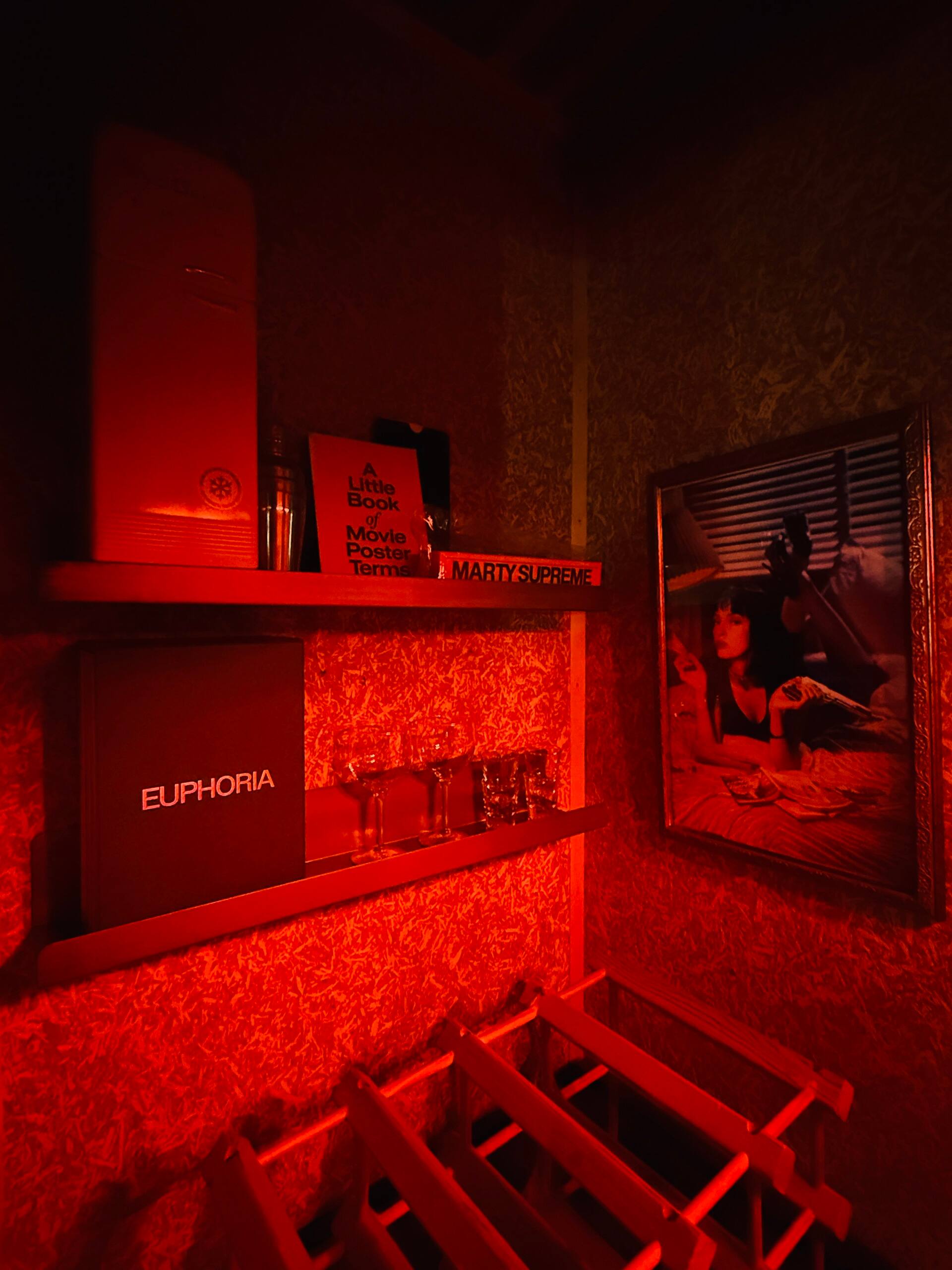 Red-lit bar shelving in the basement