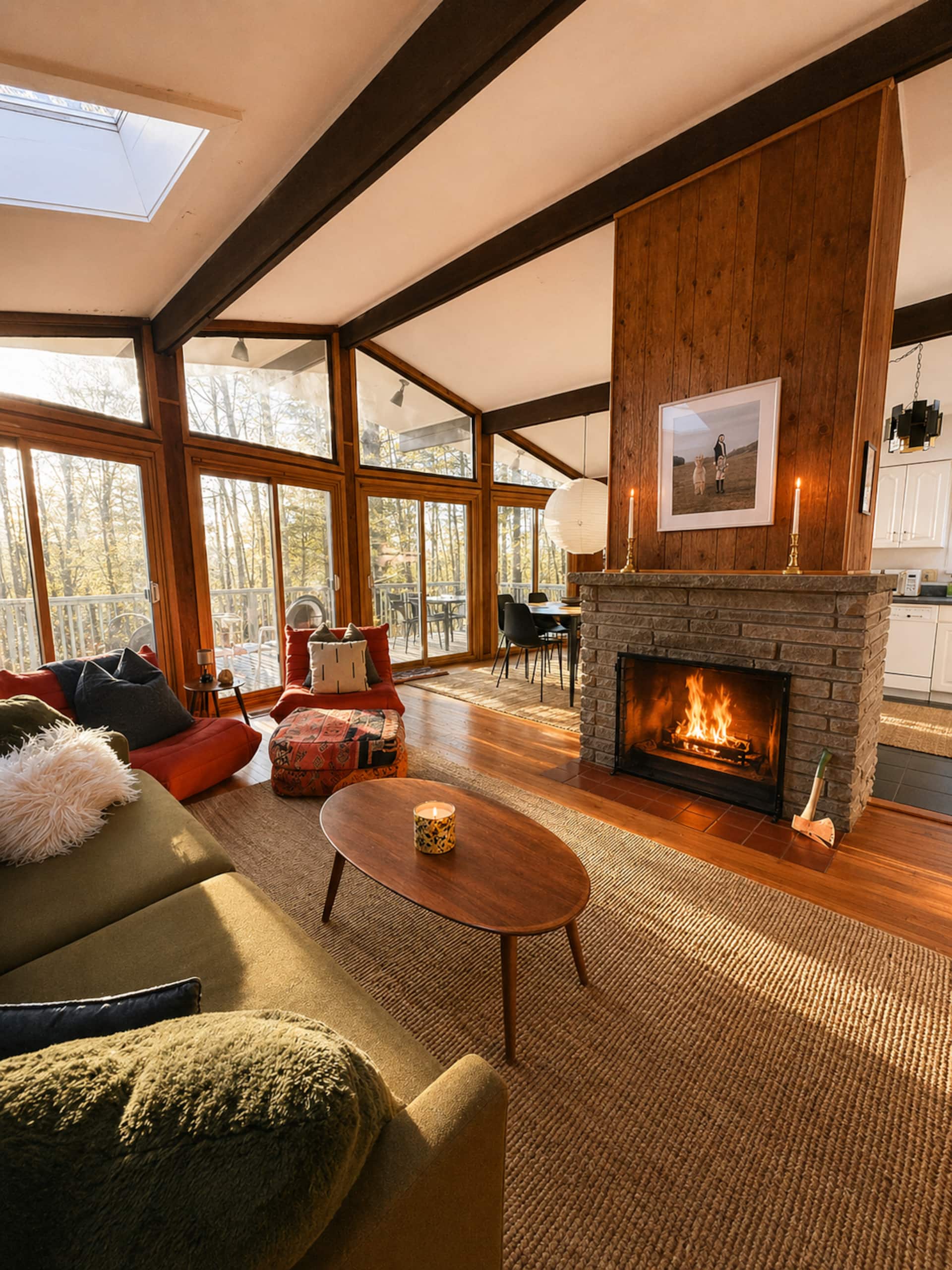 Living room fireplace with wall of windows